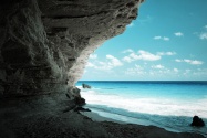 Beach cave with blue water and sky